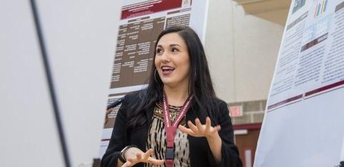 Graduate student at poster presentation